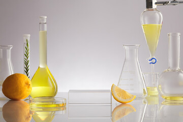 White Background  for Biological experiment presentation lemon extract and yellow water in biological test tubes. Production of cosmetics based on citrus. 