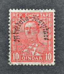 Cancelled postage stamp printed by Albania, that shows portrait of President Ahmed Zogu overprinted...