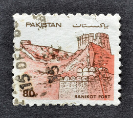 Cancelled postage stamp printed by Pakistan, that shows Hyderabad Fort, circa 1986.
