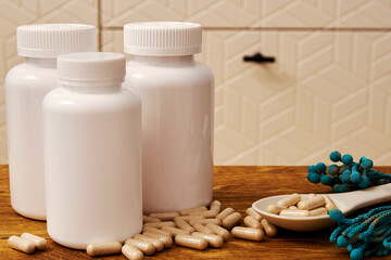 White bottles for dietary pills with place for brand. Natural tablets and medical treatment template