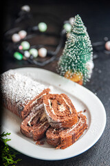 christmas cake roll chocolate white cream new year meal snack on the table copy space food background rustic 