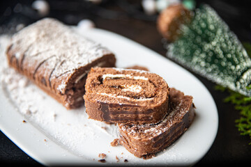 christmas cake roll chocolate white cream new year meal snack on the table copy space food background rustic 