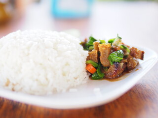Rice topped with stir fried pork and basil.