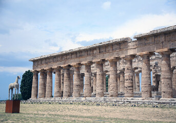 Fototapeta premium Side view of the columns of the Temple of Neptune, excavations of Paestum, Cilento, Campania, Italy