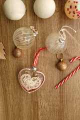 Various Christmas ornaments on wooden background. Flat lay.