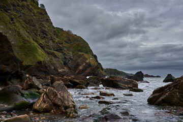 Fototapeta na wymiar Rocky beach scene from a remote location in Devon UK