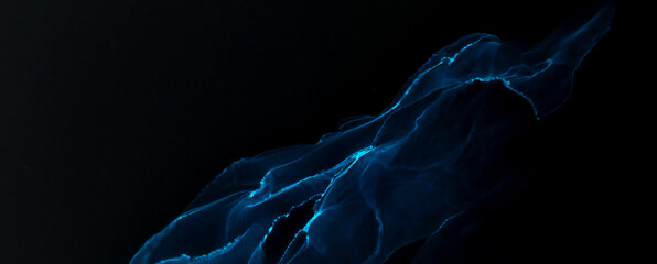 Abstract blue electric wave on black technology background. Neon light paint in water, acrylic...