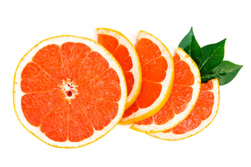 Top view of slices of red grapefruit, with green leaves