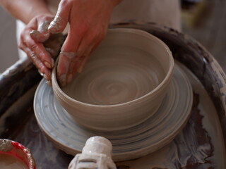 potter's wheel and potter's hands
