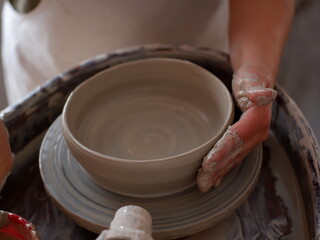 potter's wheel and potter's hands