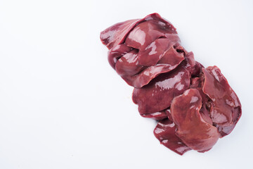 Raw chicken liver close up isolated on white background with copy space