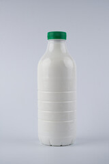 Bottle of kefir, yogurt or milk isolated on white background with copy space