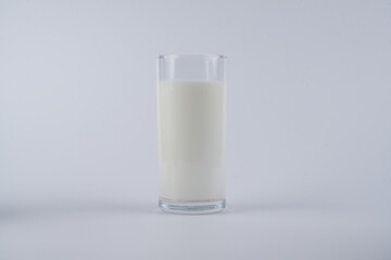 Glass of kefir, yogurt or milk isolated on white background with copy space