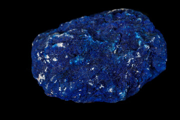 Macro mineral stone Azurite in siltstone against black background