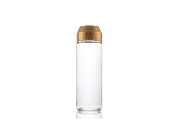 Glass bottle with water isolated on white.
