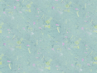 Hand-formed paper made of recycled paper and cardboard with the addition of small flowers and leaves. Seamless background. 