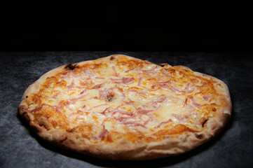 pizza with cheese and various ingredients