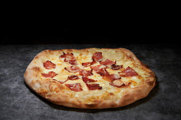 pizza with cheese and various ingredients