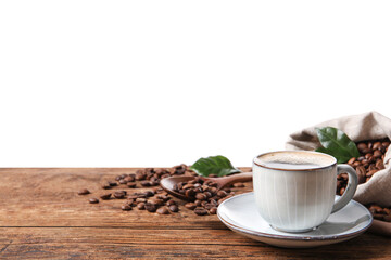 Cup of aromatic hot coffee and beans on wooden table against white background