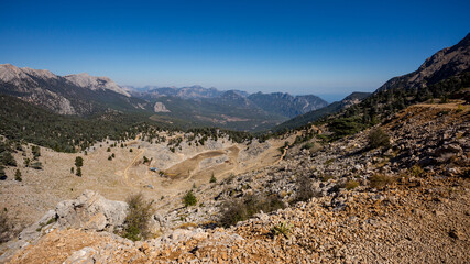Jeep trip in the mountains of Turkey along the Lycian trail. Magnificent views from the height. Pine forest and rocks. Sea view from the top.