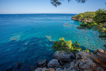 Fototapeta premium Travel in Turkey along the Lycian trail along the sea to the ancient city of Phaselis. The indescribable beauty of the small bays of the Mediterranean Sea.