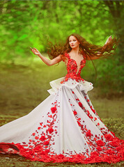 Fototapeta premium Beautiful girl with red hair in autumn park