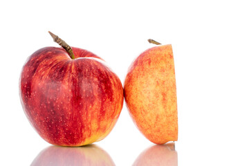 One half and one whole sweet juicy apple, close-up, isolated on white.
