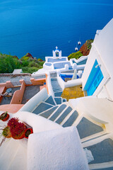 Obraz premium Santorini island, Greece. Traditional and famous houses and churches with blue domes over the Caldera, Aegean sea