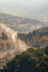 Fog over the mountains during sunrise.