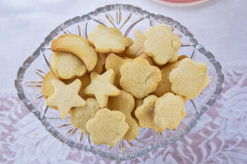 Plate with Christmas star cookies, sweet snack for kids, food for holidays . Star biscuits inside...