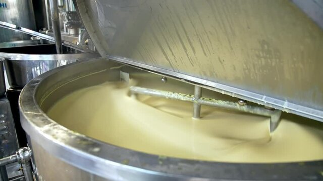 Butter production line at dairy industry. Close up view of butter production at dairy plant