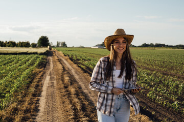 woman farmer walking on field © cherryandbees
