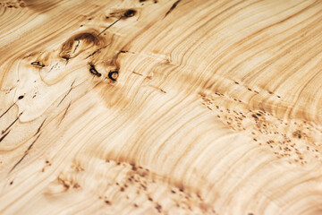 Style wooden countertop slab, saw cut wood treated with varnish close-up on black. Isolate.