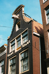 Fototapeta na wymiar Gable of an old historic building in Amsterdam