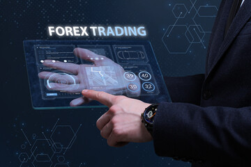 Business, Technology, Internet and network concept. Financial Graph. Stock Market chart. Young businessman working on a virtual screen of the future and sees the inscription: Forex trading