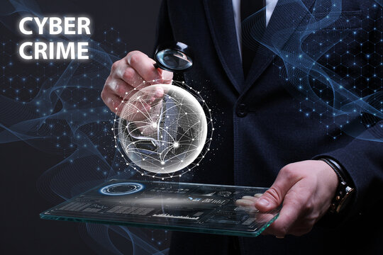 Business, Technology, Internet and network concept. Financial Graph. Stock Market chart. Young businessman working on a virtual screen of the future and sees the inscription: Cyber crime