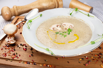 Cauliflower soup with mushrooms in a bowl