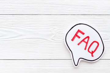 Concept of faq word on paper bubble. Frequently asked questions concept