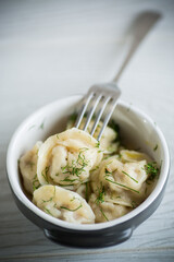 boiled dumplings with meat filling in a bowl