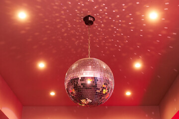 Red disco mirror ball in the club party