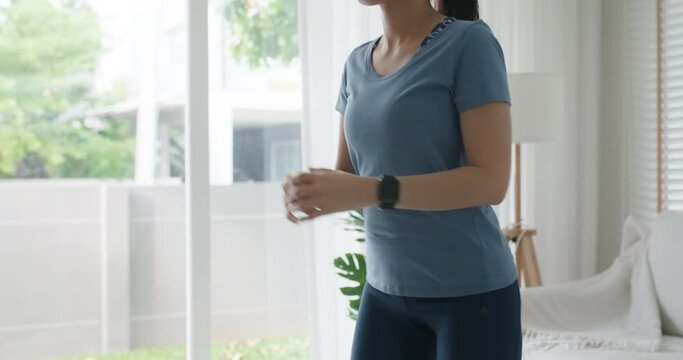 Asia people young woman wear smart VR goggles relax learn cross training at home indoor join yoga class online gym club on AI app. AR sport body build program on IoT social network.