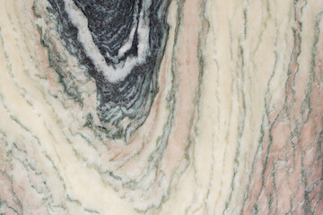 Marble granite slab with a multi-layered pattern. Natural stone texture background