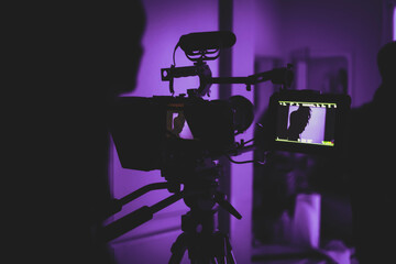 Black and gray camera with stand