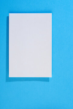 Blank paper on blue background
