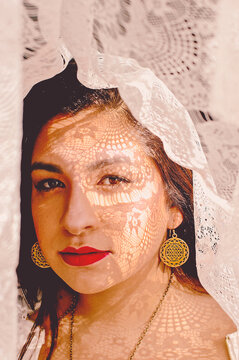 Close up of woman with lace on head