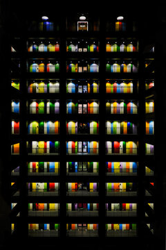 Façade of a building with colorful windows at night