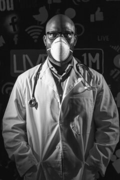 Grayscale Photo Of A Doctor Wearing Goggles And Facemask