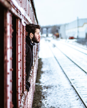 Man at the window of a train