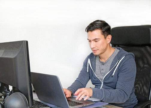 Man in casual clothes working from home