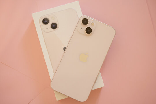 iphone 13 on pink background